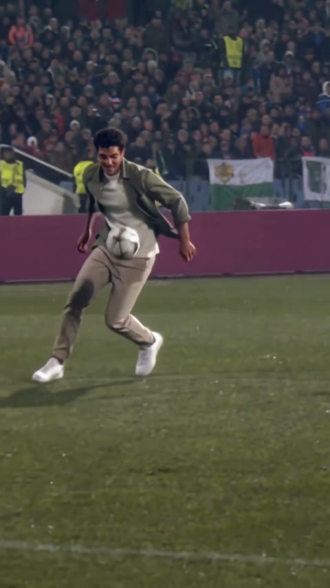 The same casually dressed player bringing the ball back under control in our generated clip